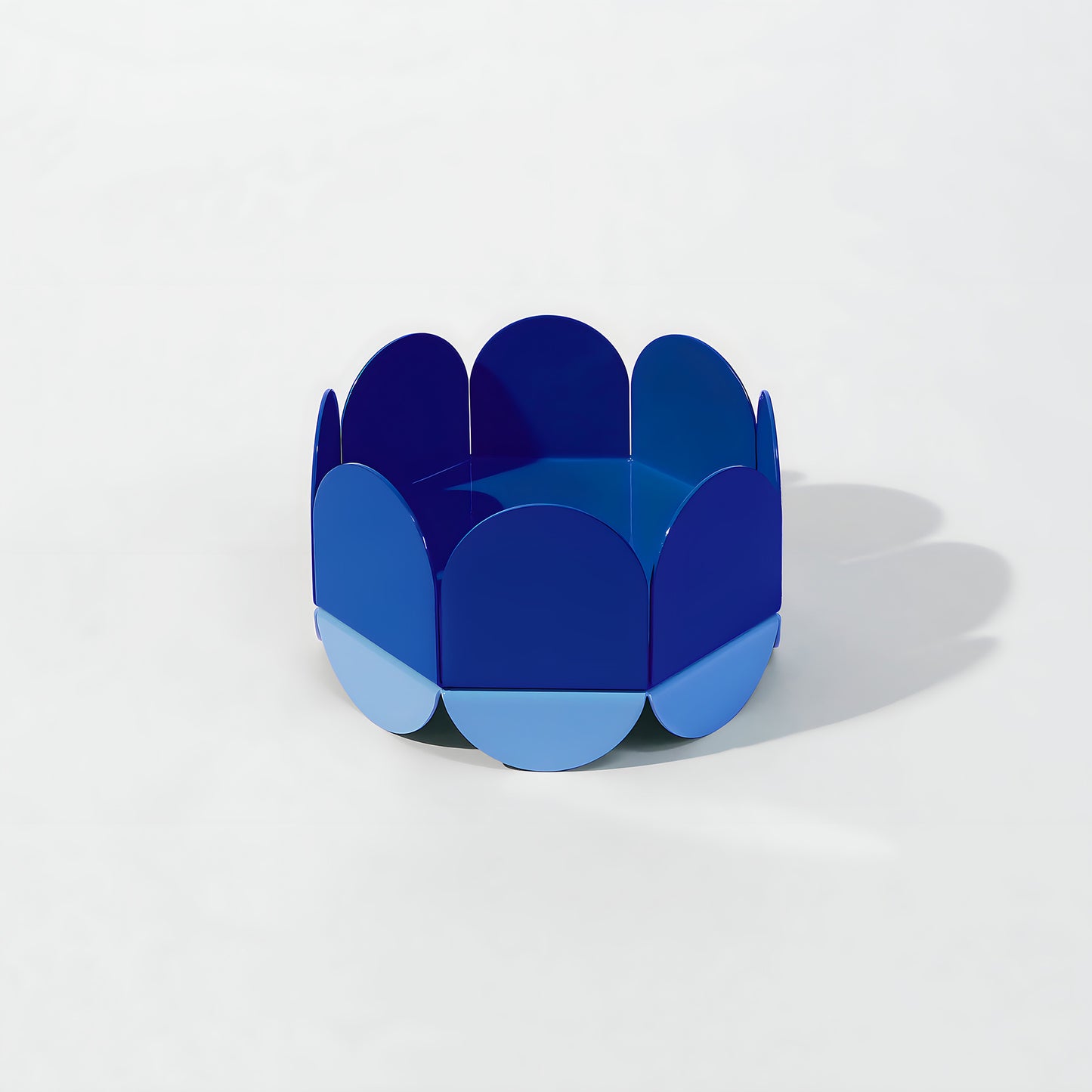 ISUWA Blue Wave Bowl – glossy metal fruit bowl with deep and light blue wave-shaped panels on a white background
