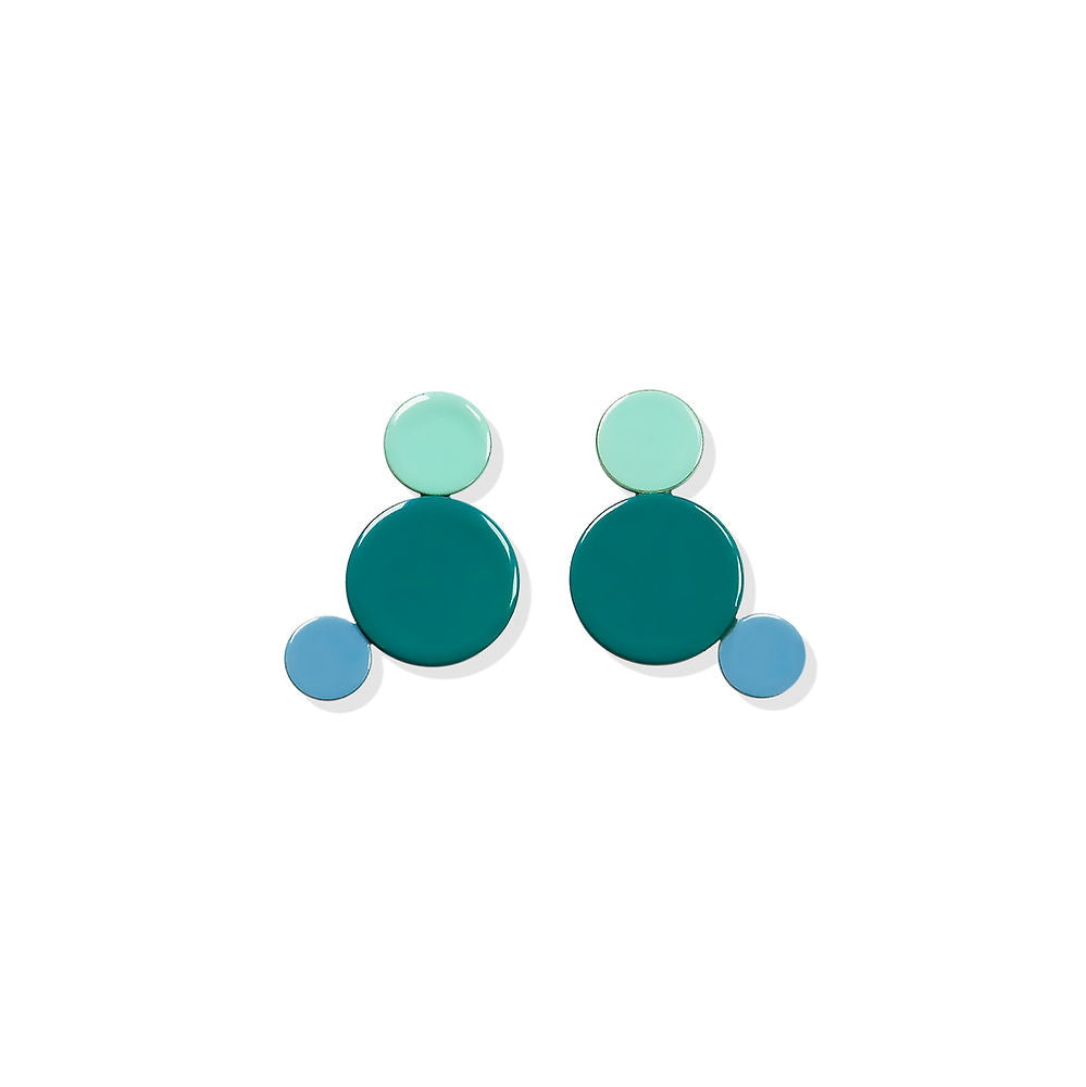 Colorful geometric earrings featuring red, sky blue and navy circles in a modern sculptural design by ISUWA.
