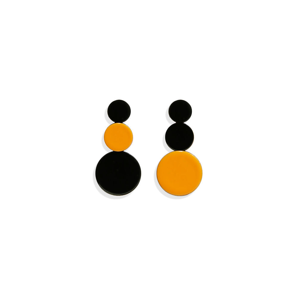 A pair of orange and black circular cluster earrings with a glossy finish, featuring stacked round shapes in a vertical design. Photographed on a white background.
