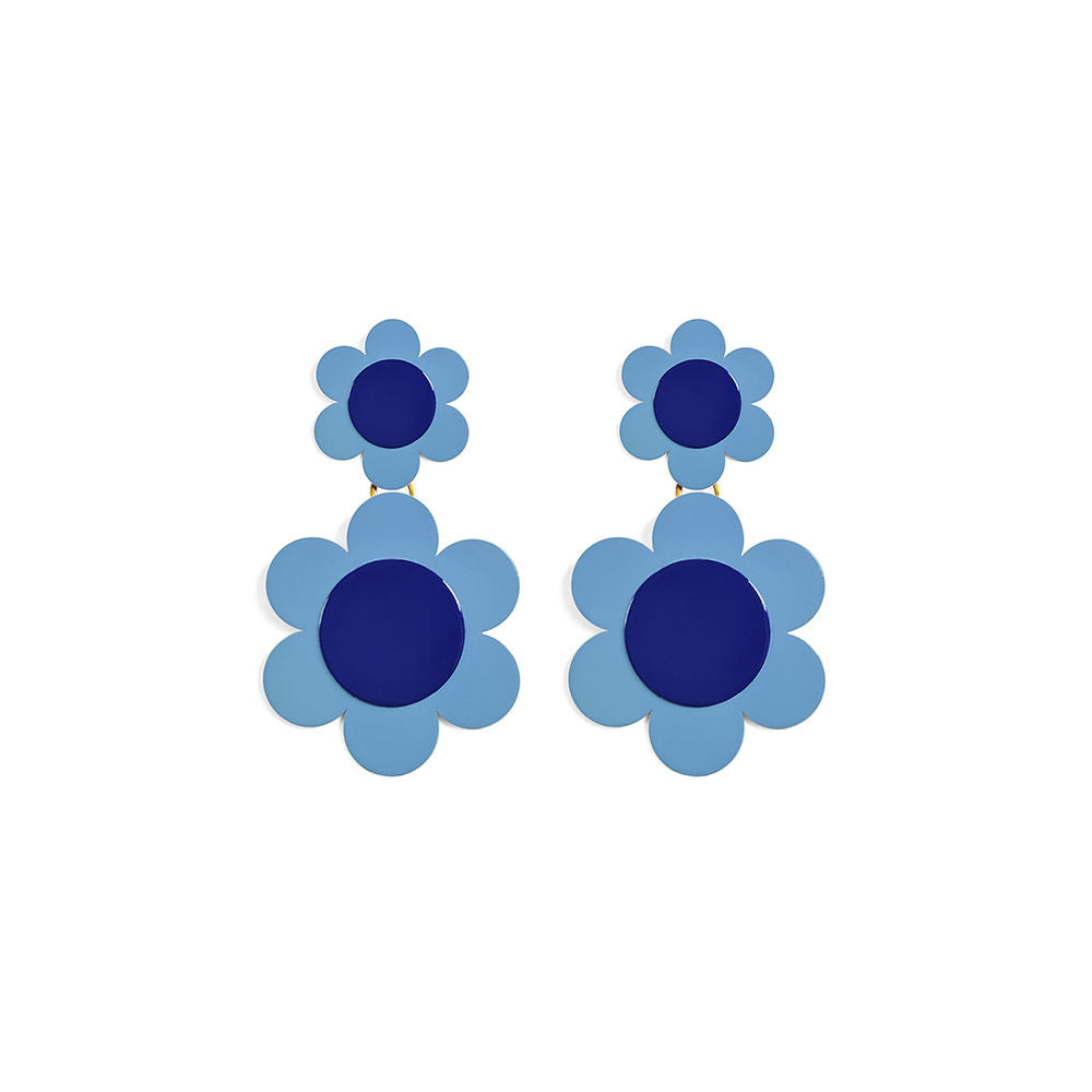 Pair of large blue daisy statement earrings with layered floral shapes and deep blue centers, displayed on a white background.