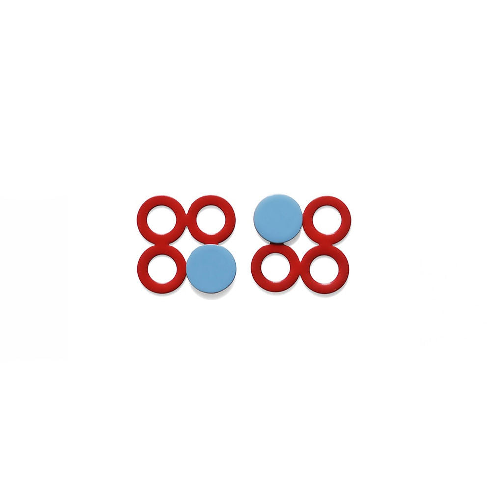 A pair of red and sky blue geometric earrings with four red circles and one glossy blue disc on each side. Displayed on a white background with clean symmetry.
