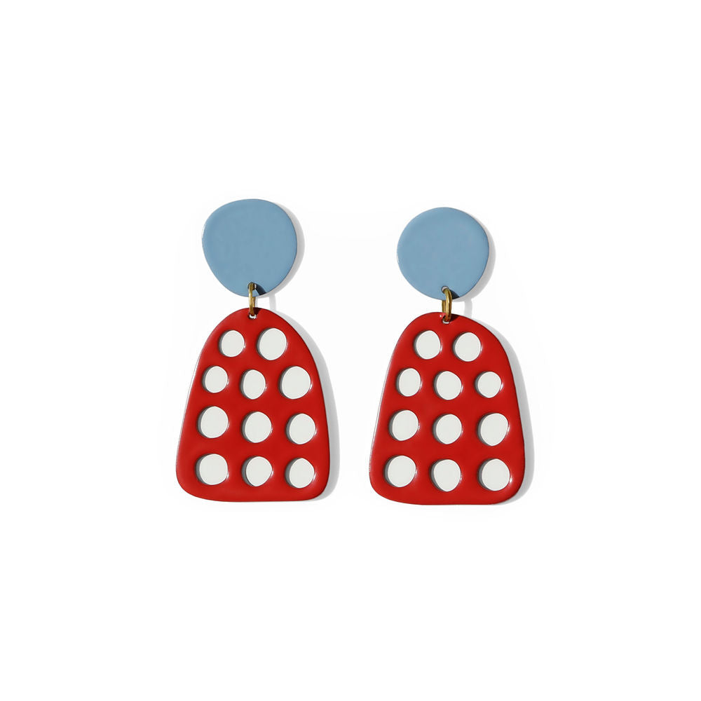 Pair of red earrings with circular white cut-out dots and light blue round tops, styled on white background.