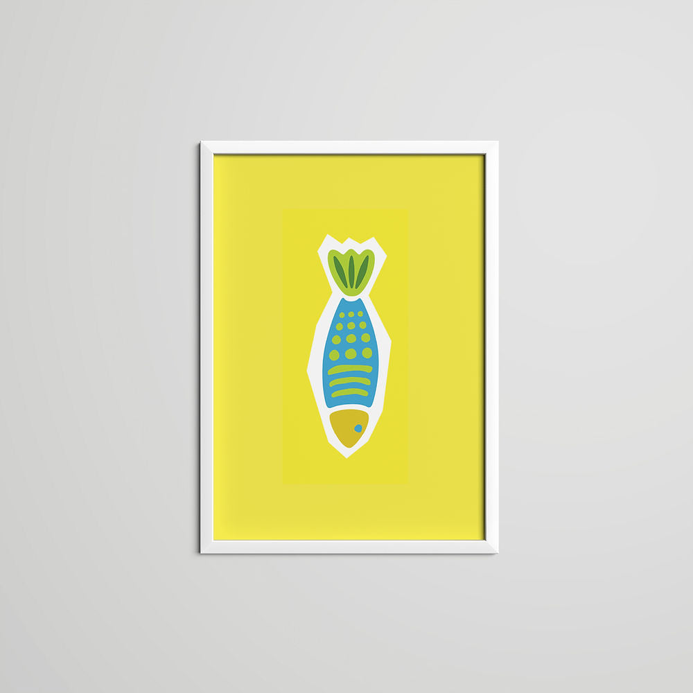A bright yellow art print featuring a stylized blue and green fish illustration in a white frame on a light grey wall.
