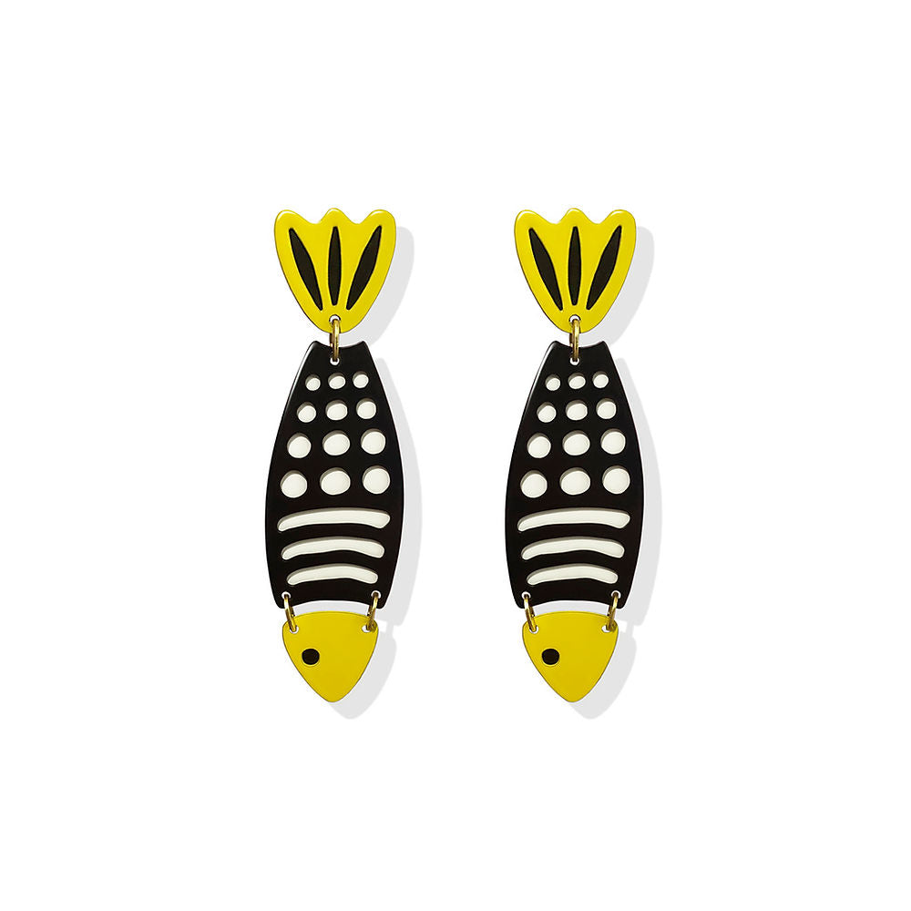 Black fish-shaped earrings with white detailing and bright yellow tail and head, designed by ISUWA and photographed on a white background.
