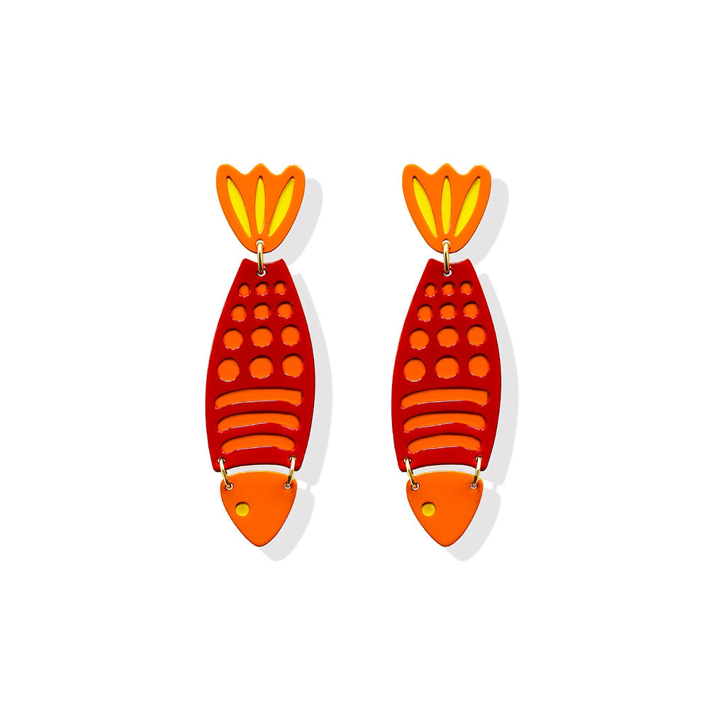 Sculptural fish-shaped earrings in red, orange and yellow with layered metal design, created by ISUWA and photographed on a white background.
