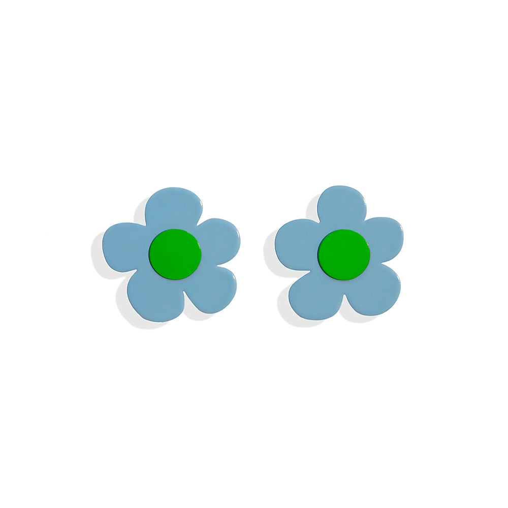 Playful flower-shaped earrings in light blue with a vivid green center, designed by ISUWA and photographed on a white background.
