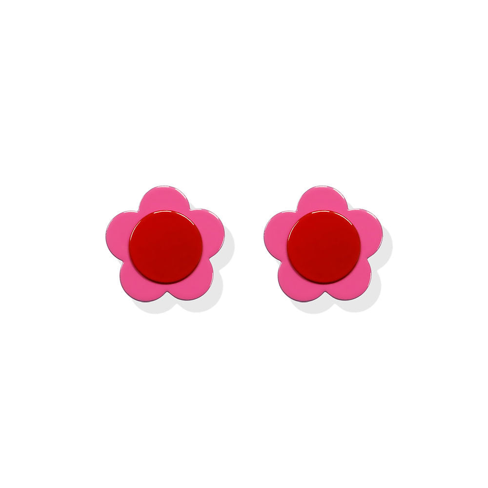 Flower-shaped earrings with bright pink petals and a red center, designed by ISUWA and photographed on a white background.
