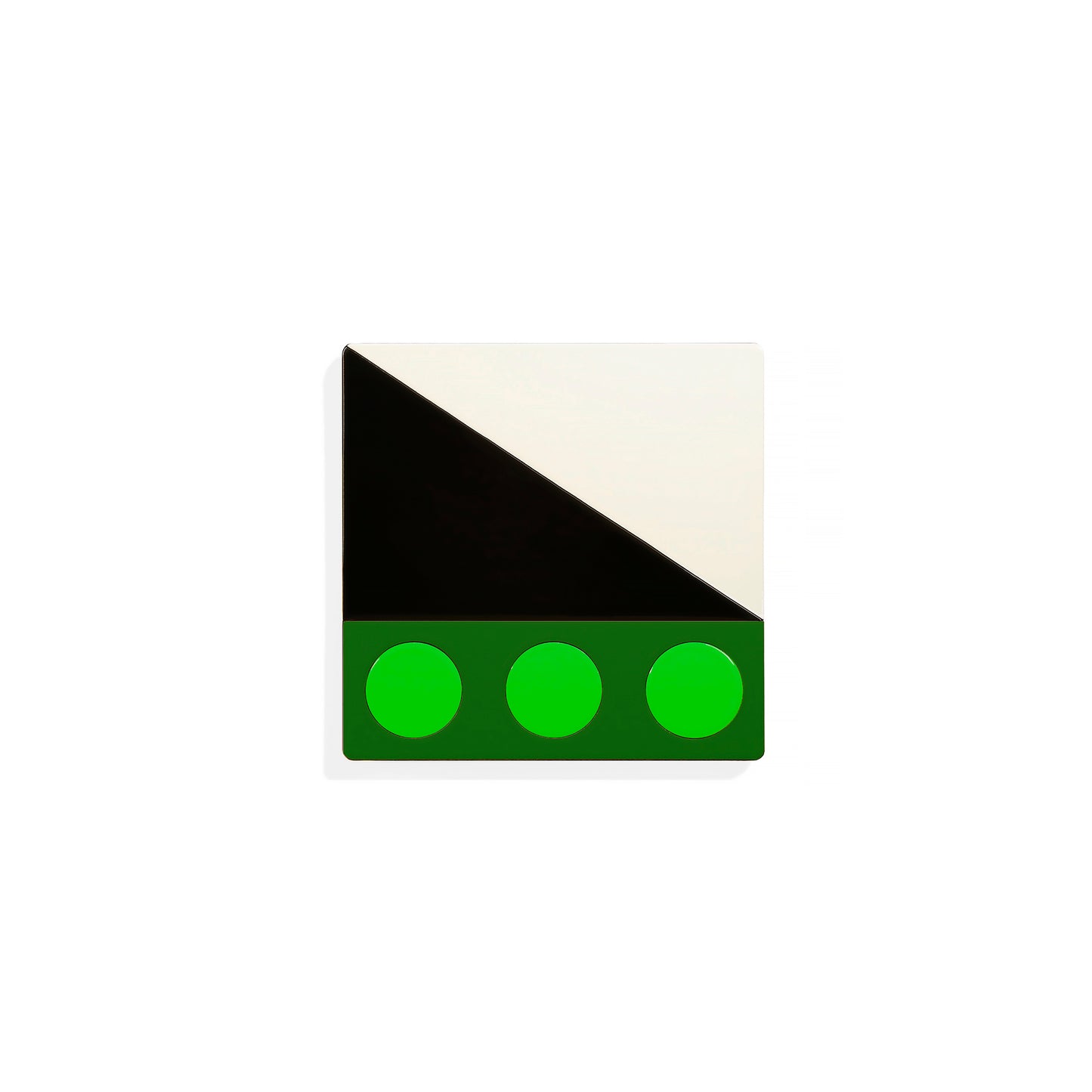 Green square metal coaster with diagonal black-and-white split and three vivid green circles – handcrafted by ISUWA for bold geometric table styling