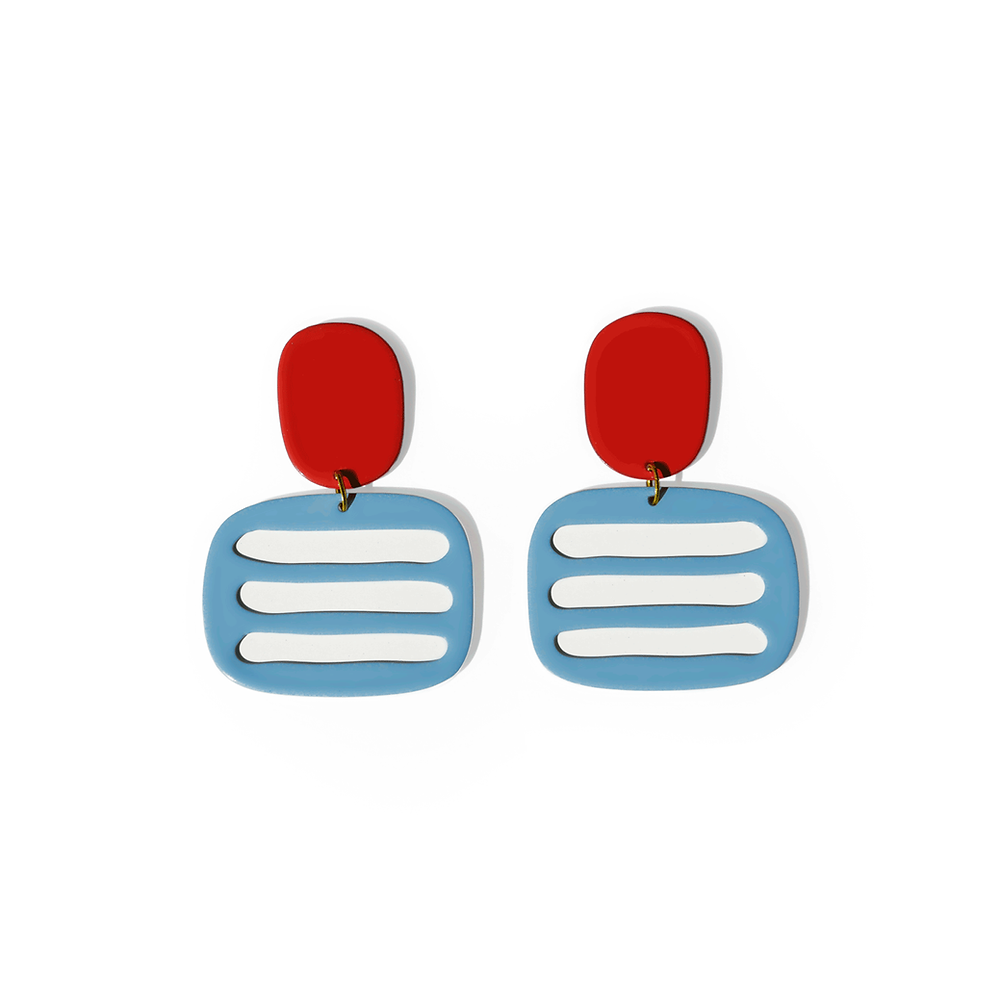 Pair of graphic earrings with red tops and blue bases featuring three white horizontal lines, shown on a white background.
