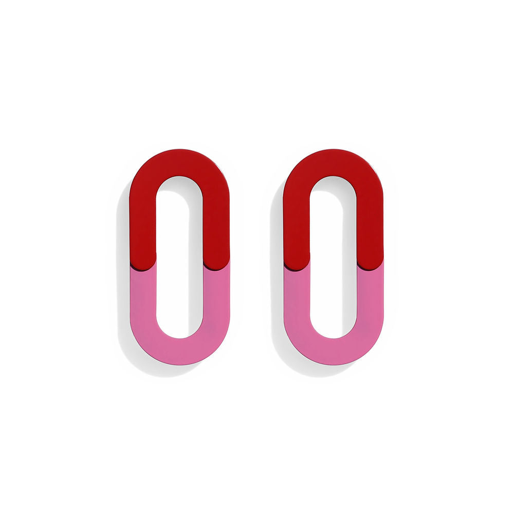 Pair of oval-shaped loop earrings in red and pink with a color block split design, displayed on a white background.
