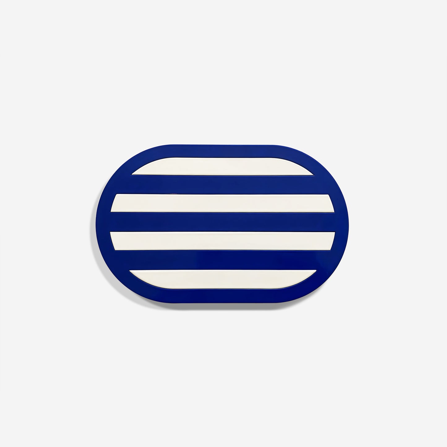 Premium navy oval metal coaster with minimalist striped design and glossy finish – handcrafted tableware by ISUWA for elegant table settings