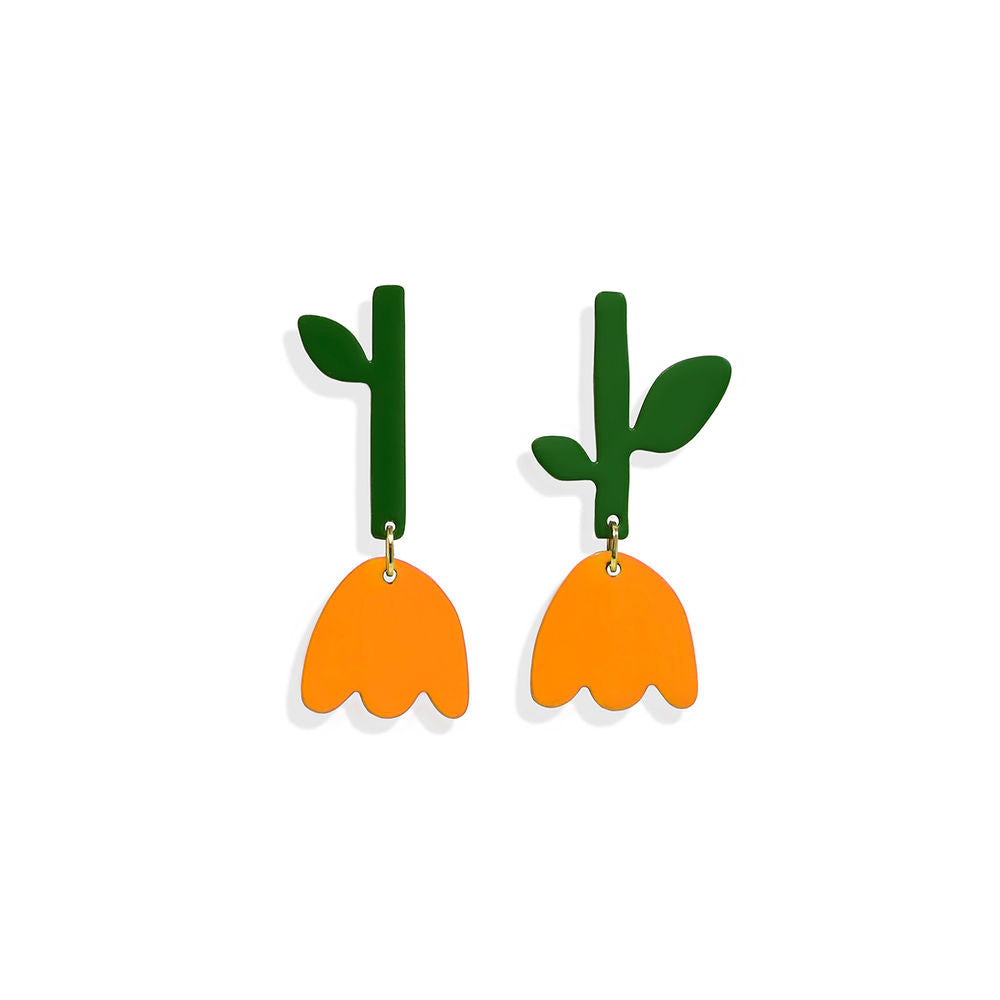 Pair of orange tulip-shaped earrings with green stems and leaves, displayed on a white background.
