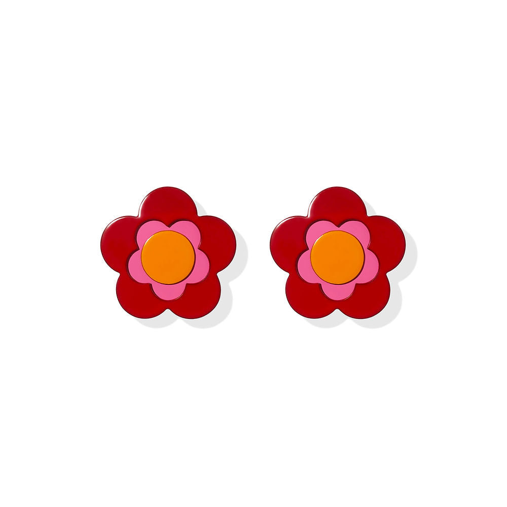 Layered flower-shaped earrings with red petals, a pink inner bloom and orange center, designed by ISUWA and photographed on a white background.
