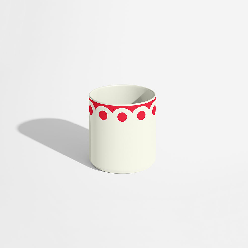 ISUWA’s red dots porcelain coffee cup with a scalloped rim, photographed from the front on a white background.
