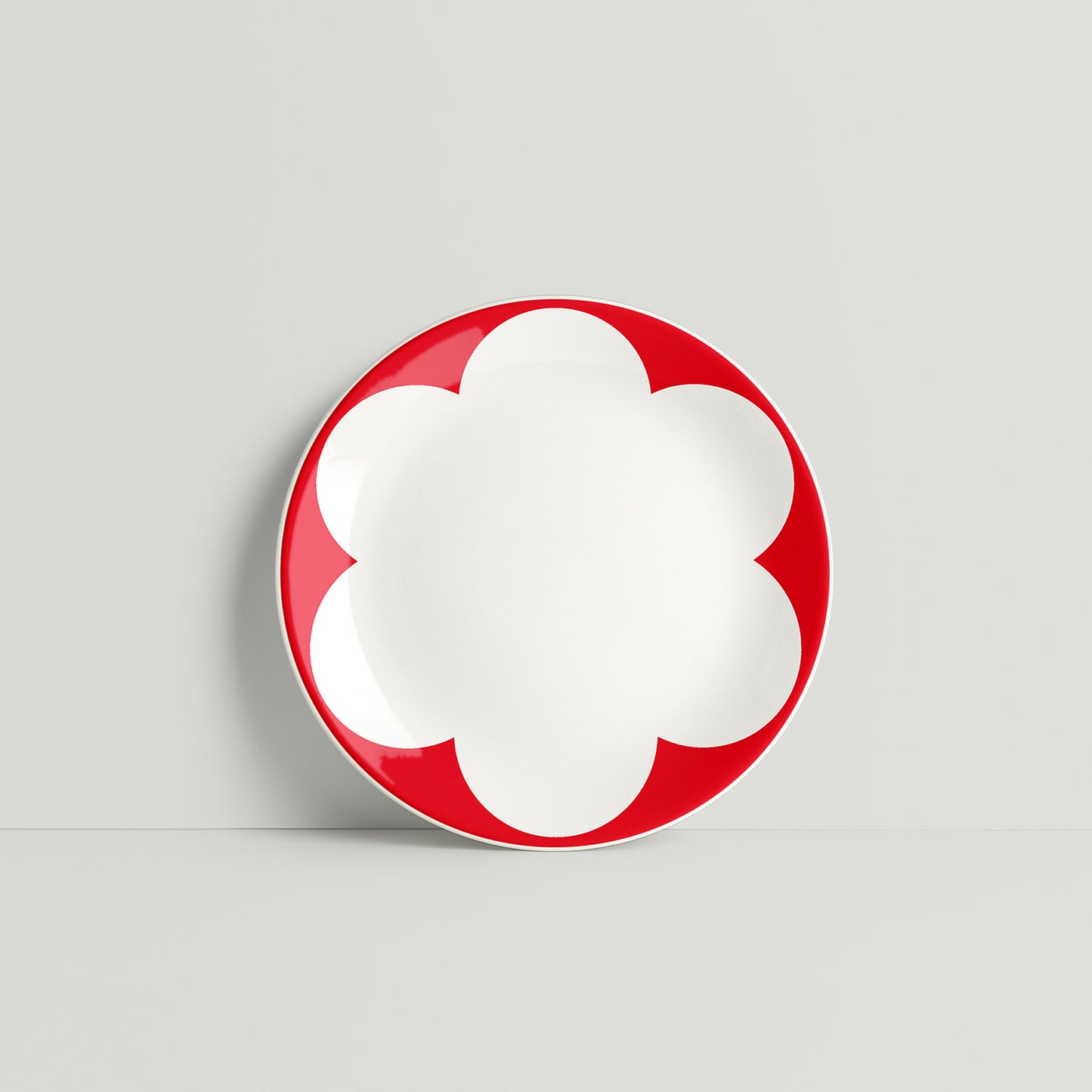 ISUWA red daisy plate with petal-shaped border design in glazed porcelain
