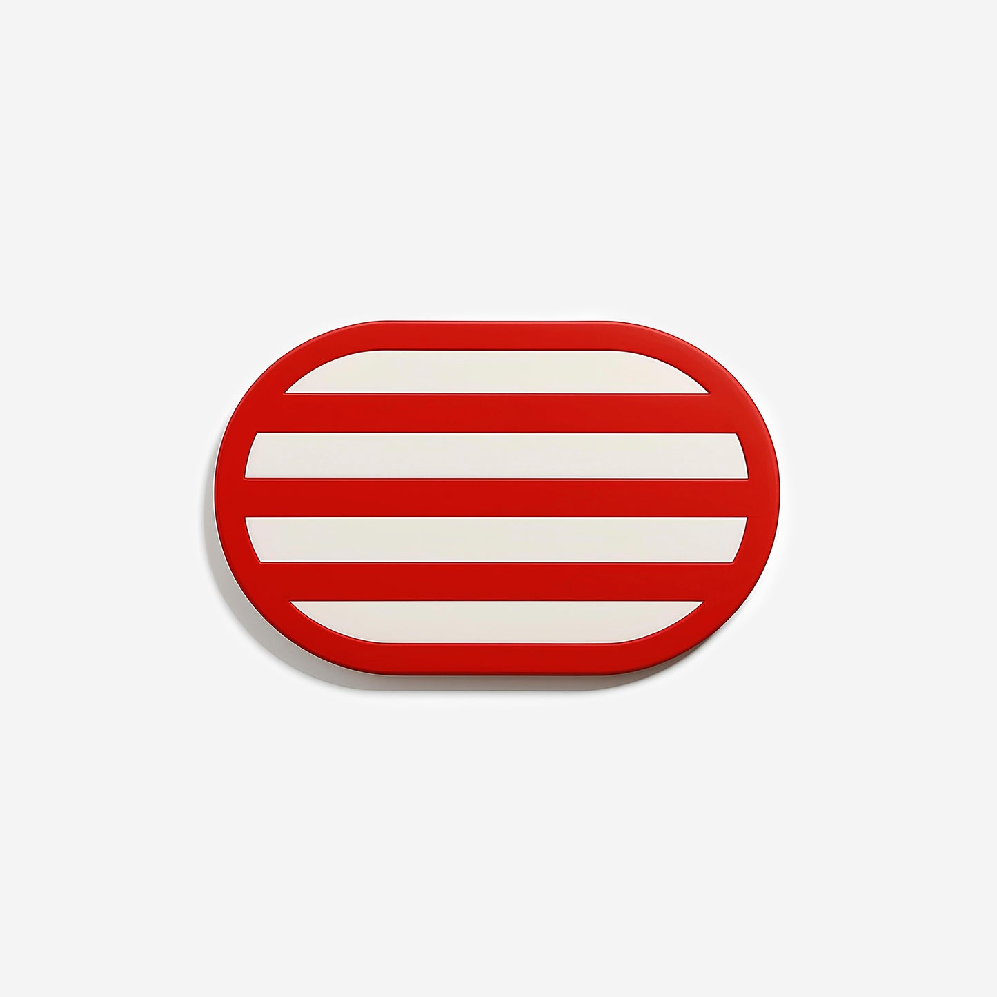 Premium red oval metal coaster with bold striped design and glossy finish – handcrafted tableware by ISUWA for vibrant table styling