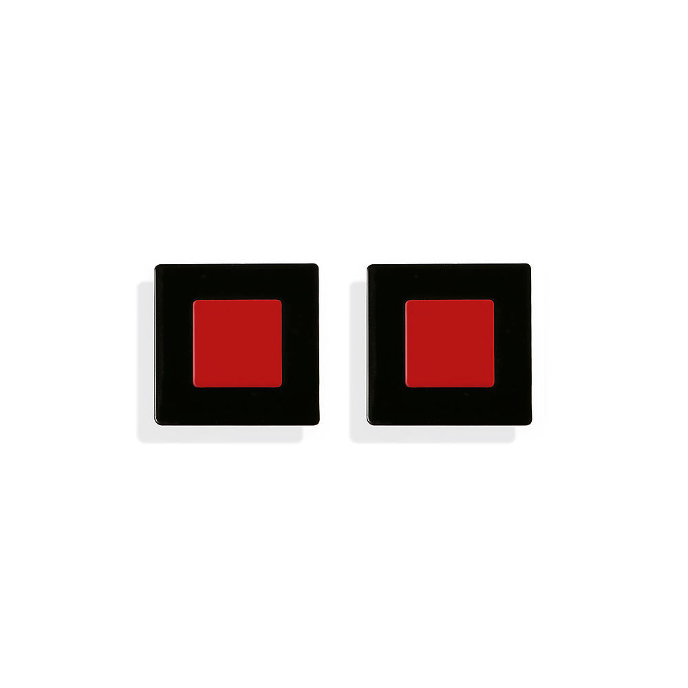 Front-facing view of ISUWA’s red and black square earrings with a bold geometric design, photographed on a white background.
