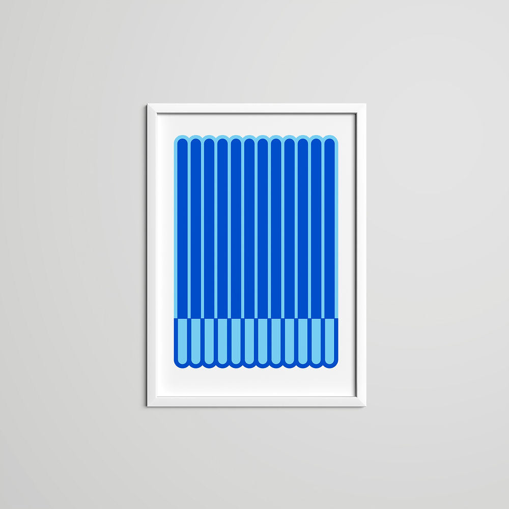 A blue geometric art print with vertical stripe patterns in two tones of blue, framed in white. A bold and modern wall decor piece from ISUWA.
