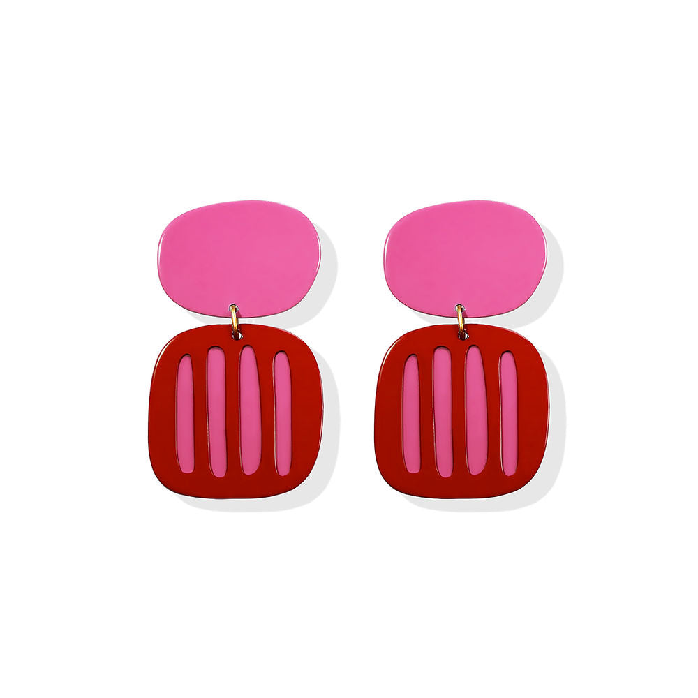 Pair of bold red and pink striped earrings with vertical cut-out design and rounded tops, displayed on a white background.