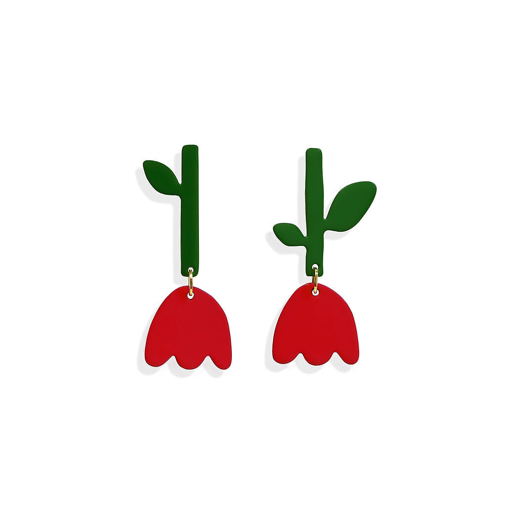 A pair of tulip-shaped red earrings with green stems and leaves, designed in a bold and playful style – handmade and nature-inspired by ISUWA.
