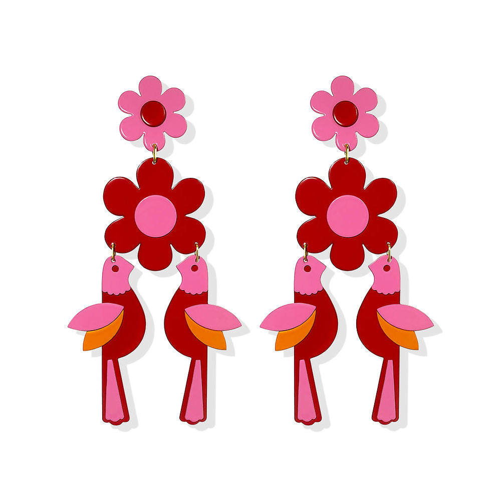 ISUWA Bird Statement Earrings – artistic red earrings with pink flower tops and bold bird motifs, accented with orange and pink wings, creating a colorful and imaginative contemporary design on a white background.