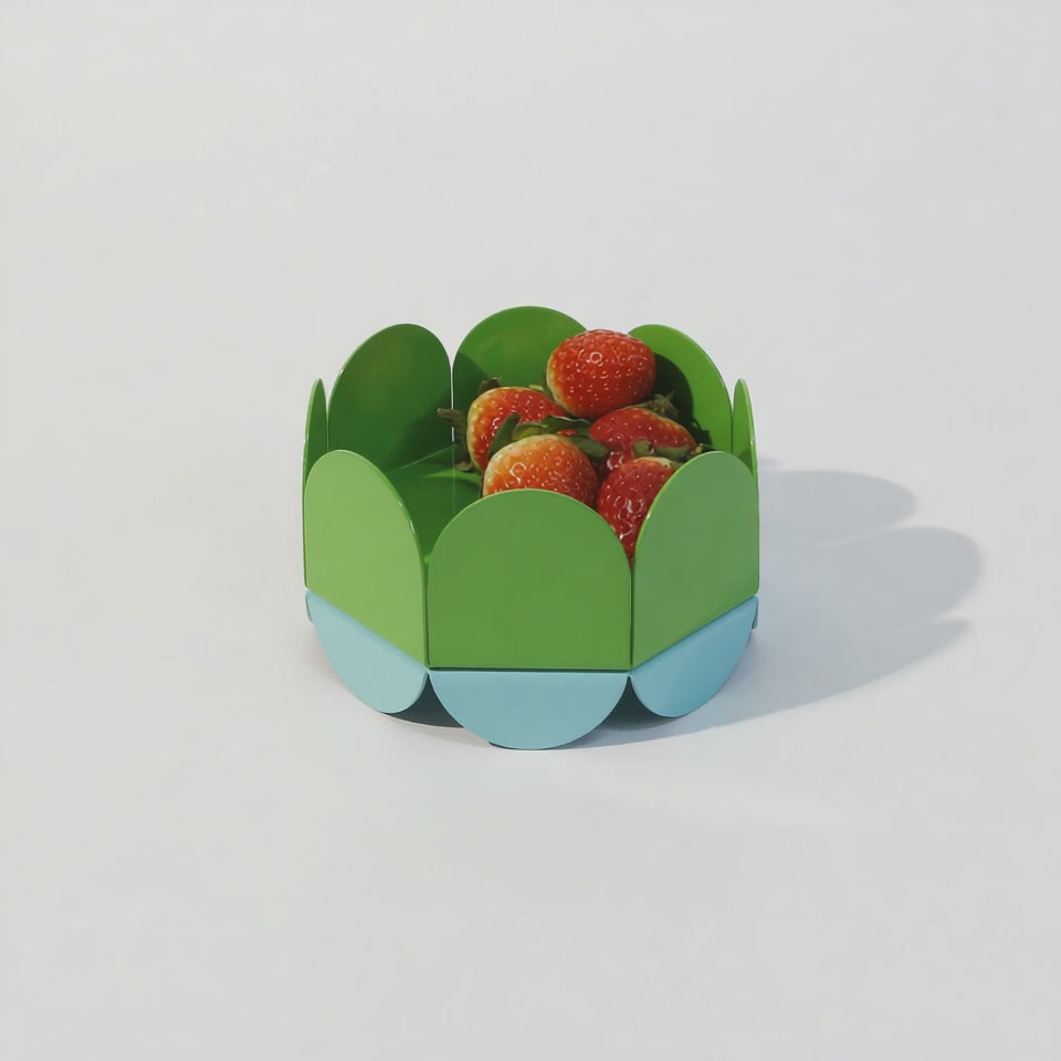 A glossy Green Wave Bowl is shown in a slow zoom-in motion, highlighting its sculptural wave-shaped panels in vibrant green and aqua. The camera draws closer, emphasizing its curved form and glossy finish. Fresh, artistic, and full of life.