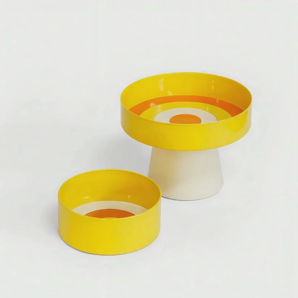 Video showcasing the Loop Serving Bowl in yellow with orange and cream concentric rings. The rotating view highlights the glossy finish, sculptural form and vibrant interior pattern.