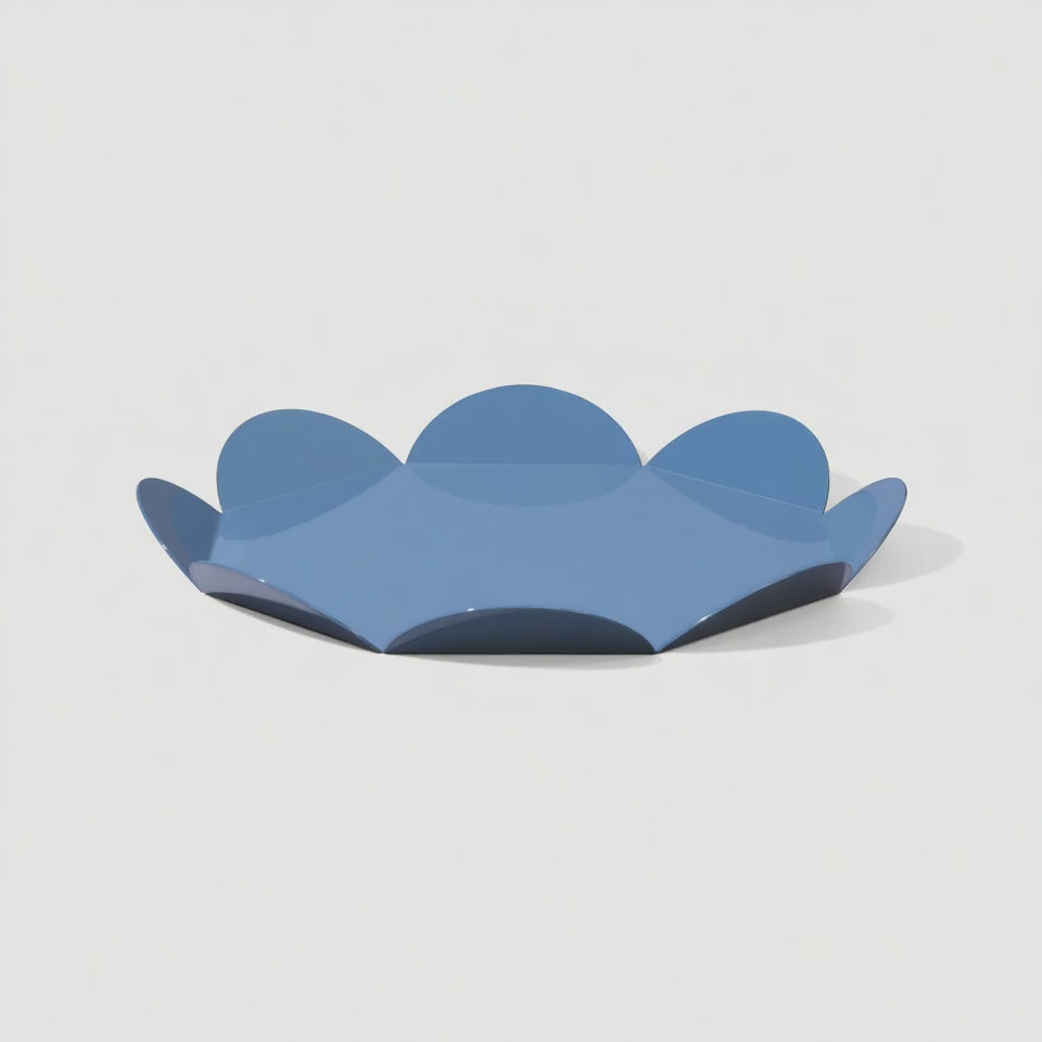 A rotating view of a blue flower-shaped metal tray with a glossy finish. The video showcases the tray’s sculptural petal edges and smooth reflective surface from all angles.
